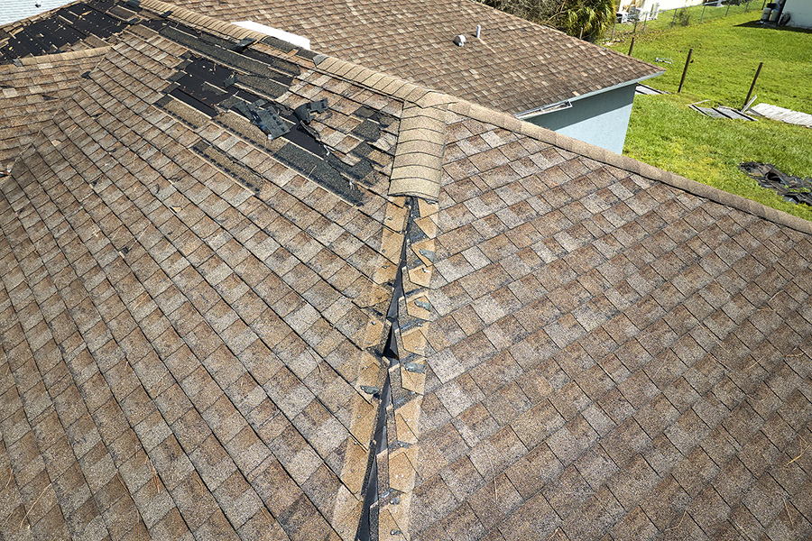 Damaged  house roof with missing tile