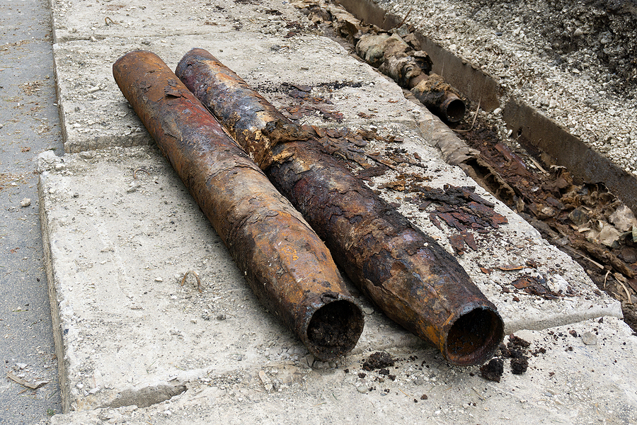 Old rusty cast iron sewer pipes.